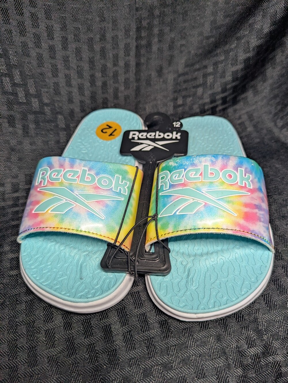 Aqua & Tie-Dye Reebok Slide Sandals.